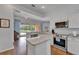 Bright kitchen featuring granite countertops, stainless steel appliances, and an open layout at 8749 Ashworth Dr, Tampa, FL 33647