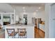 Well-lit kitchen with stainless steel appliances, granite countertops, and open view to living spaces at 8749 Ashworth Dr, Tampa, FL 33647