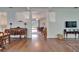 Open-concept living room with hardwood floors, neutral walls, seamlessly connects to the patio view at 8749 Ashworth Dr, Tampa, FL 33647