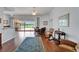 Living room with hardwood floors, bright interior, patio access, and elegant furnishings at 8749 Ashworth Dr, Tampa, FL 33647