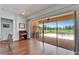 Bright living area with large sliding glass doors opening to a screened lanai with brick flooring at 8749 Ashworth Dr, Tampa, FL 33647