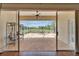 View of screened-in lanai, showcasing the brick flooring and a outdoor seating area at 8749 Ashworth Dr, Tampa, FL 33647