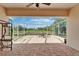 Spacious screened lanai with brick flooring and a beautiful view of the green surroundings at 8749 Ashworth Dr, Tampa, FL 33647