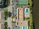 Aerial view showing pool, tennis court, and parking at 10038 62Nd N Ter # 2, St Petersburg, FL 33708