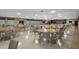 Large community room with tables and chairs for events at 10038 62Nd N Ter # 2, St Petersburg, FL 33708