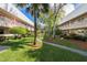 Community courtyard with landscaping and seating area at 10038 62Nd N Ter # 2, St Petersburg, FL 33708