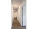 Bright hallway with wood-look flooring and multiple doors at 12128 Grouse Ave, Port Charlotte, FL 33981