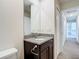 Modern bathroom with granite countertop and dark brown vanity at 12128 Grouse Ave, Port Charlotte, FL 33981