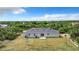 Rear view of a newly built home with a small patio at 12128 Grouse Ave, Port Charlotte, FL 33981