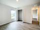 Spacious bedroom with wood flooring and a large closet at 12128 Grouse Ave, Port Charlotte, FL 33981