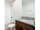 Bathroom with granite countertop and a dark brown vanity at 12128 Grouse Ave, Port Charlotte, FL 33981