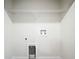 Laundry room with wire shelving and hookups for washer/dryer at 12128 Grouse Ave, Port Charlotte, FL 33981