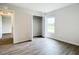Spacious bedroom with wood-look floors and a large closet at 12128 Grouse Ave, Port Charlotte, FL 33981