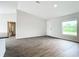 Bright living room with wood-look floors and a window at 12128 Grouse Ave, Port Charlotte, FL 33981