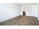 Spacious bedroom with wood-look flooring and an ensuite bathroom at 12128 Grouse Ave, Port Charlotte, FL 33981