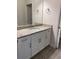 Bathroom with a single vanity, granite countertop and white cabinets at 4506 Georgia Ave, North Port, FL 34288