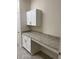 Laundry room with white cabinets, granite countertops, and ample workspace at 4506 Georgia Ave, North Port, FL 34288