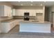 Kitchen with white cabinets, granite countertops and an island at 4506 Georgia Ave, North Port, FL 34288