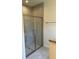 Walk-in shower with glass enclosure and grey tile at 4619 Chamrade Rd, North Port, FL 34288