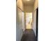 Bright hallway with carpet flooring and access to bedrooms and bathroom at 4619 Chamrade Rd, North Port, FL 34288