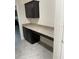 Laundry room with granite countertop and dark brown cabinets at 4619 Chamrade Rd, North Port, FL 34288