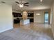 Open kitchen with island and dark cabinetry at 3481 Nashville Rd, North Port, FL 34288