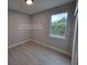 Bright bedroom with a window and wood-look floors at 12168 Van Gough Ave, Port Charlotte, FL 33981