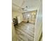 A well lit bedroom with wood floors, ceiling fan, and ample storage space at 6480 Center Lane, North Port, FL 34287