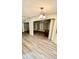 A dining room featuring wood flooring, and a vintage chandelier that offers comfortable space at 6480 Center Lane, North Port, FL 34287