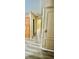 A hallway featuring wood flooring, paneled walls, and vintage cabinetry detail at 6480 Center Lane, North Port, FL 34287