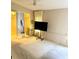 Spacious carpeted main bedroom with walk-in closet and TV at 6480 Center Lane, North Port, FL 34287