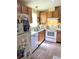 Cozy kitchen featuring wood cabinets and modern appliances at 6480 Center Lane, North Port, FL 34287