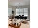 Modern kitchen with island, dining area, and white cabinets at 3101 Hollow Hickory Pl, Wesley Chapel, FL 33543