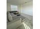 Spacious living room with large sectional sofa at 3101 Hollow Hickory Pl, Wesley Chapel, FL 33543