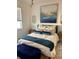 Cozy bedroom with comfortable bed and stylish decor at 3101 Hollow Hickory Pl, Wesley Chapel, FL 33543