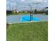 Outdoor basketball court with blue and grey surface at 3101 Hollow Hickory Pl, Wesley Chapel, FL 33543