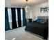 Spacious main bedroom with large bed and window coverings at 3101 Hollow Hickory Pl, Wesley Chapel, FL 33543