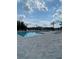 Inviting community pool with plenty of lounge chairs at 3101 Hollow Hickory Pl, Wesley Chapel, FL 33543