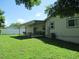 The large backyard includes a covered patio, perfect for entertaining and enjoying the outdoors at 4469 Keyes Ave, Spring Hill, FL 34606