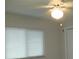 Bedroom with ceiling fan and a window with blinds at 4469 Keyes Ave, Spring Hill, FL 34606