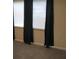 Bedroom featuring neutral walls, carpet, a window with dark curtains, and baseboard trim at 4469 Keyes Ave, Spring Hill, FL 34606