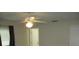 Bedroom boasts a ceiling fan and a neutral color palette, creating a soothing and versatile space at 4469 Keyes Ave, Spring Hill, FL 34606