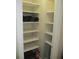 Neat and organized storage closet with shelving at 4469 Keyes Ave, Spring Hill, FL 34606