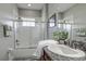 Bathroom with a shower/tub combo, granite countertop, and modern fixtures at 4224 Crayford Ct, Land O Lakes, FL 34638