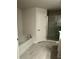 Modern bathroom featuring a soaking tub, separate shower, and tile flooring at 12283 Ipswich Sparrow Rd, Weeki Wachee, FL 34614