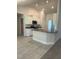 Well-lit kitchen with granite countertops, stainless steel appliances, and ample storage space at 12283 Ipswich Sparrow Rd, Weeki Wachee, FL 34614