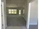 Bright living room featuring neutral walls, carpet and ample natural light at 12283 Ipswich Sparrow Rd, Weeki Wachee, FL 34614