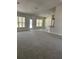 Spacious living room with gray carpet and a breakfast bar at 12283 Ipswich Sparrow Rd, Weeki Wachee, FL 34614