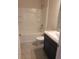 Bright bathroom featuring a shower-tub combo with built-in shelves and a modern vanity at 324 Galaxy Ave, Spring Hill, FL 34606
