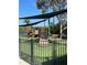 Community playground with slides and shade structures at 19617 Sunset Bay Dr, Land O Lakes, FL 34638